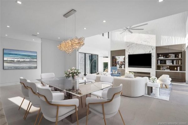 Modern living room with elegant dining area.