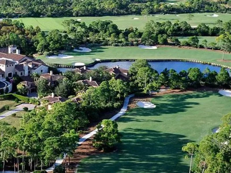 Aerial view of a lush golf course landscape.