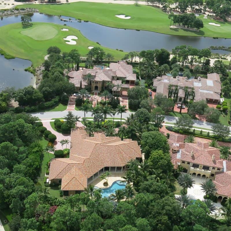 Aerial view of luxurious homes by a golf course