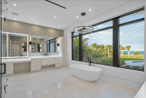 Luxurious bathroom with ocean view and freestanding tub.